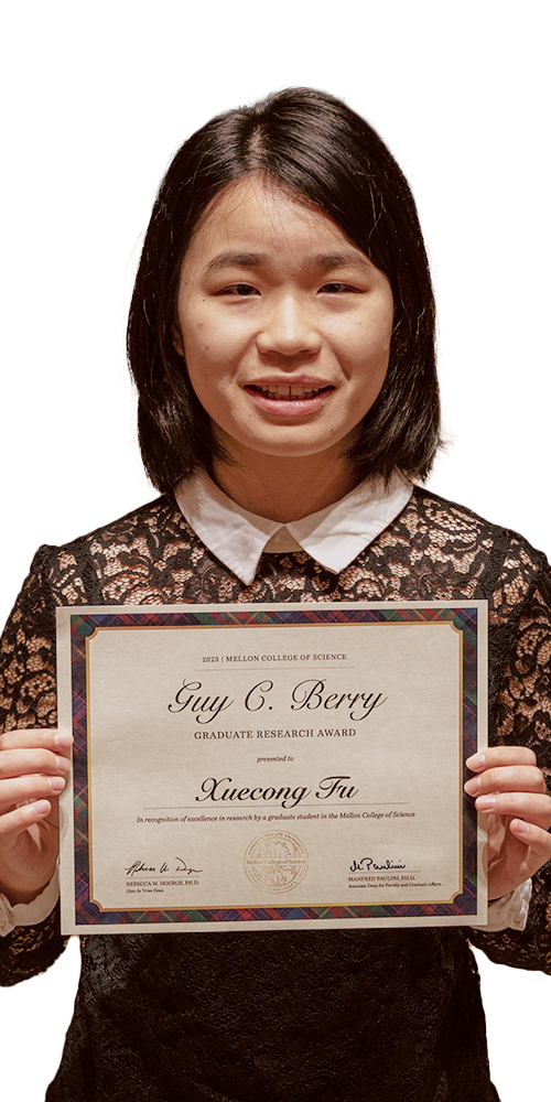 photo of Xuecong Fu holding a diploma